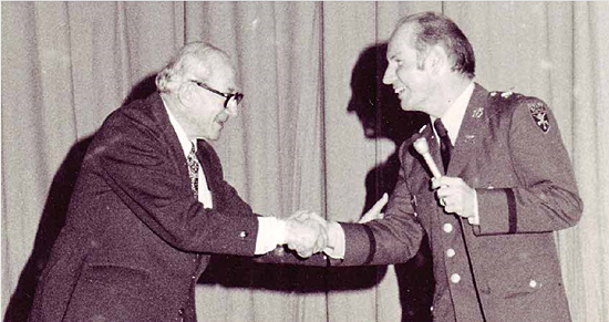 Dr. Franz Polgar is welcomed by FUMA faculty member, Col. Robert Spencer, ca. 1975
