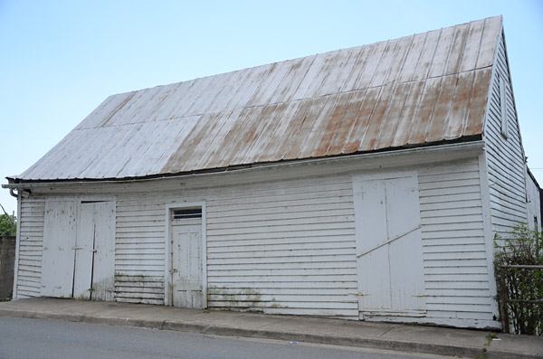 White frame building on Main St. which was once part of Tutwiler Boatyard
