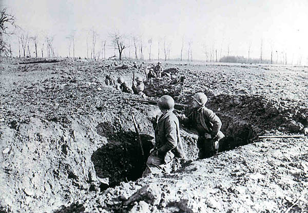 I/274 troops in German trenches on outskirts of Spicheren, France, 22 Feb 1945. 
