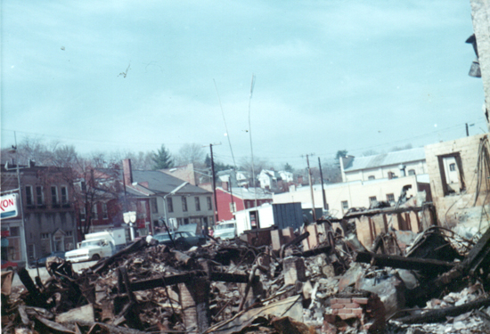 Fire rubble from Turner's Exxon gas station and Travelers Rest Hotel, 26 Feb. 1976