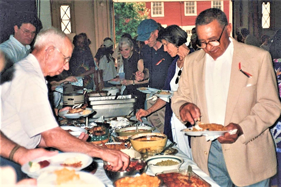 Campbell Holt and Joe Agee of Southside Fellowship serve up their plates