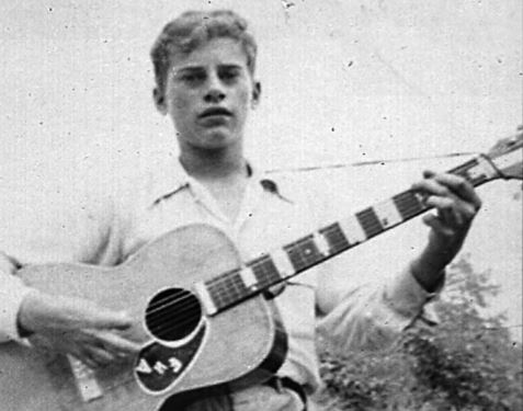 Eddie Adcock playing a guitar in the 1950's
