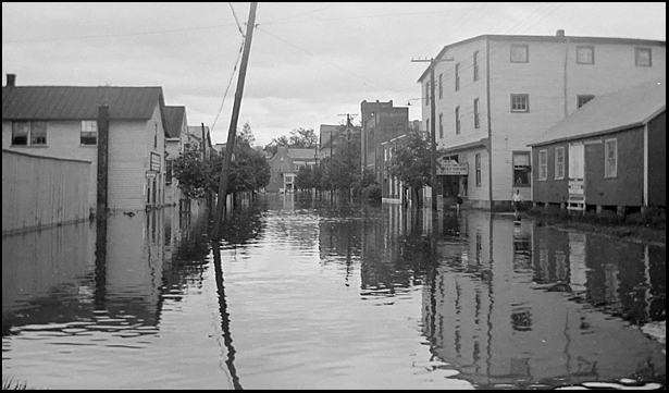 1935 flood looking west toward Paulett's Store and the Methodist Church