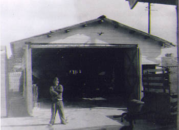 John Barnes in front of his motor shop in Kyushu, Japan