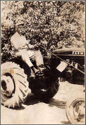 John Farrish on the family tractor near Scottsville