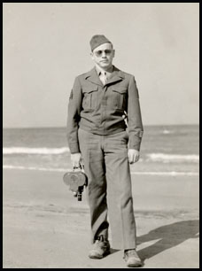 Milton with camera on Italian beach